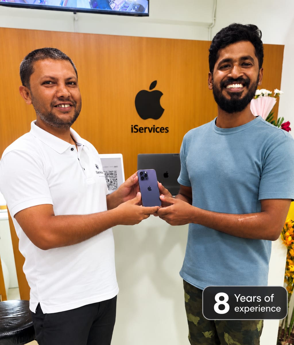 iServices Centre team at the Hyderabad workshop handing over a repaired iPhone to a customer
