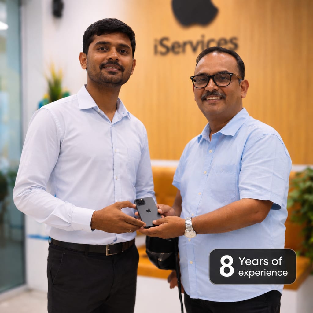 iServices Centre team at the Hyderabad workshop handing over a repaired iPhone to a customer